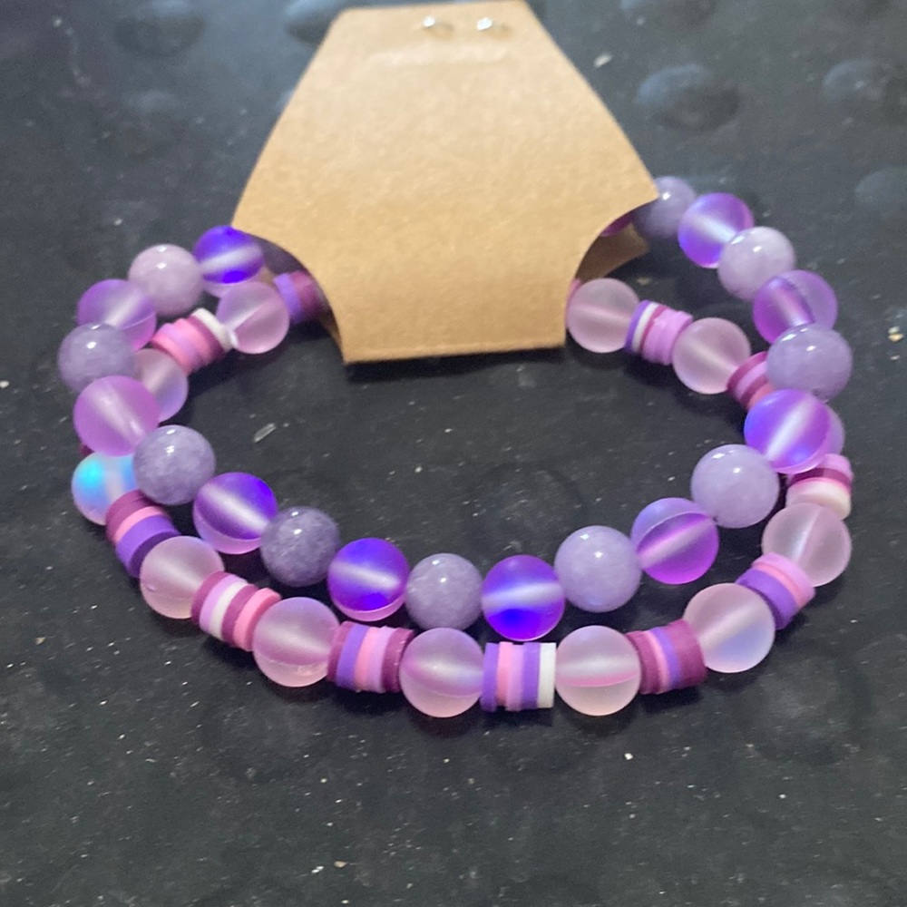 2 6 1/2 inch bracelets w/stretchy bands, illuminating&glass beads.That light up.